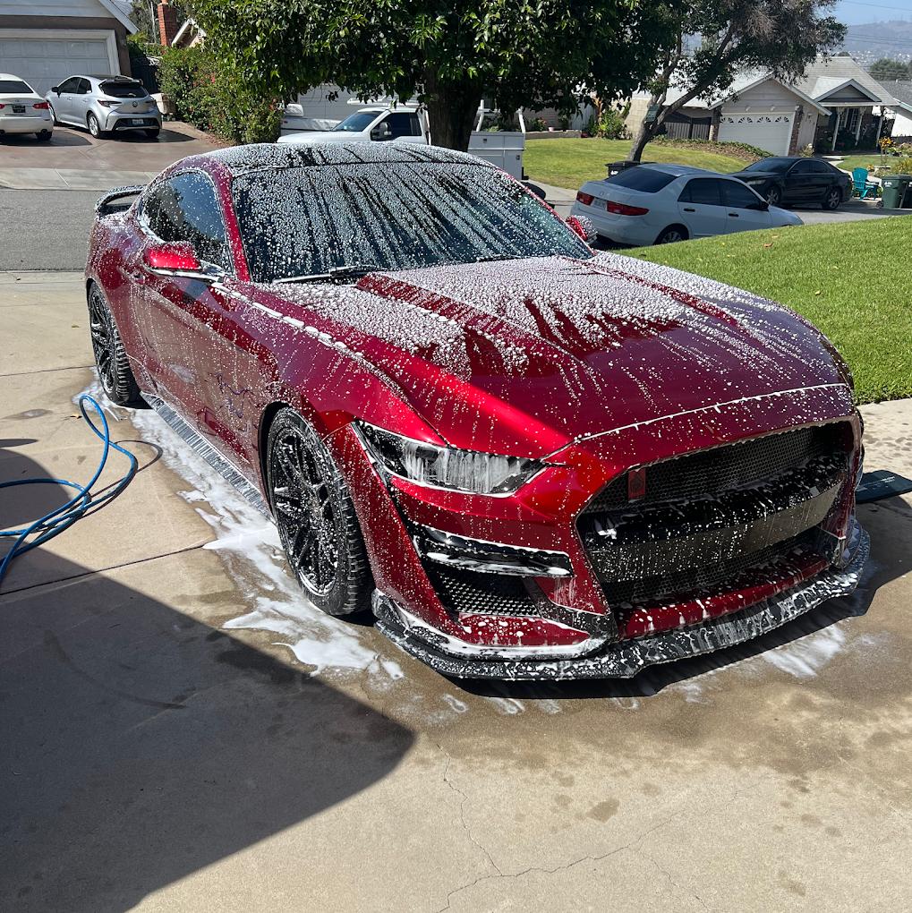 First Class Mobile Car Detailing washing a red Mustang in Utah Valley